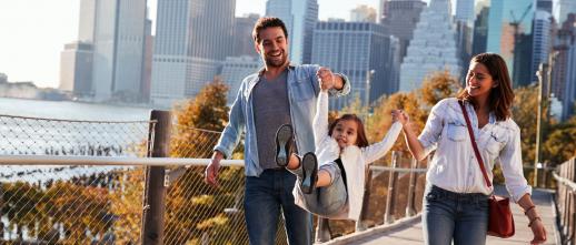 Family walking by the water in NYC